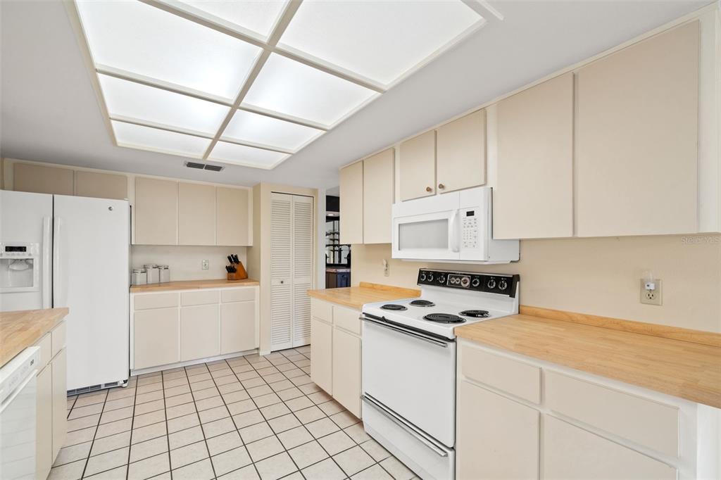 6404 Lost Tree Lane Spring Hill, FL 34606 - Photo 25 of 63 a kitchen with cabinets and appliances