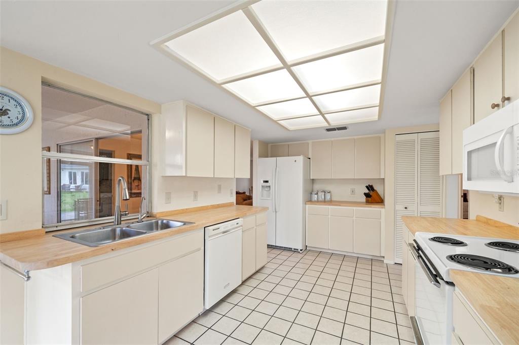 6404 Lost Tree Lane Spring Hill, FL 34606 - Photo 26 of 63 a kitchen that has a sink and a stove in it