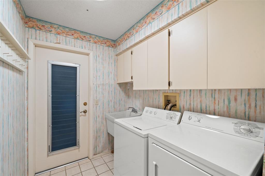 6404 Lost Tree Lane Spring Hill, FL 34606 - Photo 36 of 63 a utility room with dryer and washer