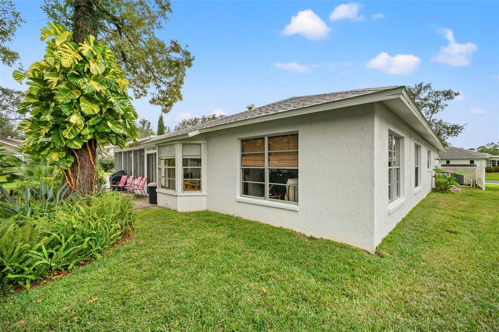 6404 Lost Tree Lane Spring Hill, FL 34606 - Photo 41 of 63 a view of a house with a yard