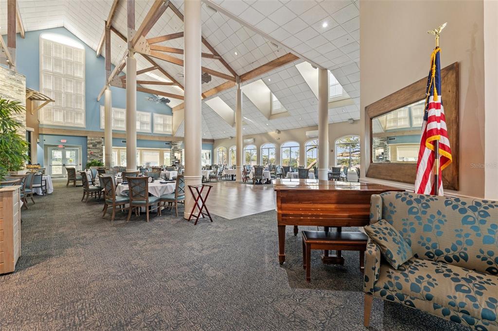 6404 Lost Tree Lane Spring Hill, FL 34606 - Photo 60 of 63 a living room filled with furniture and a chandelier