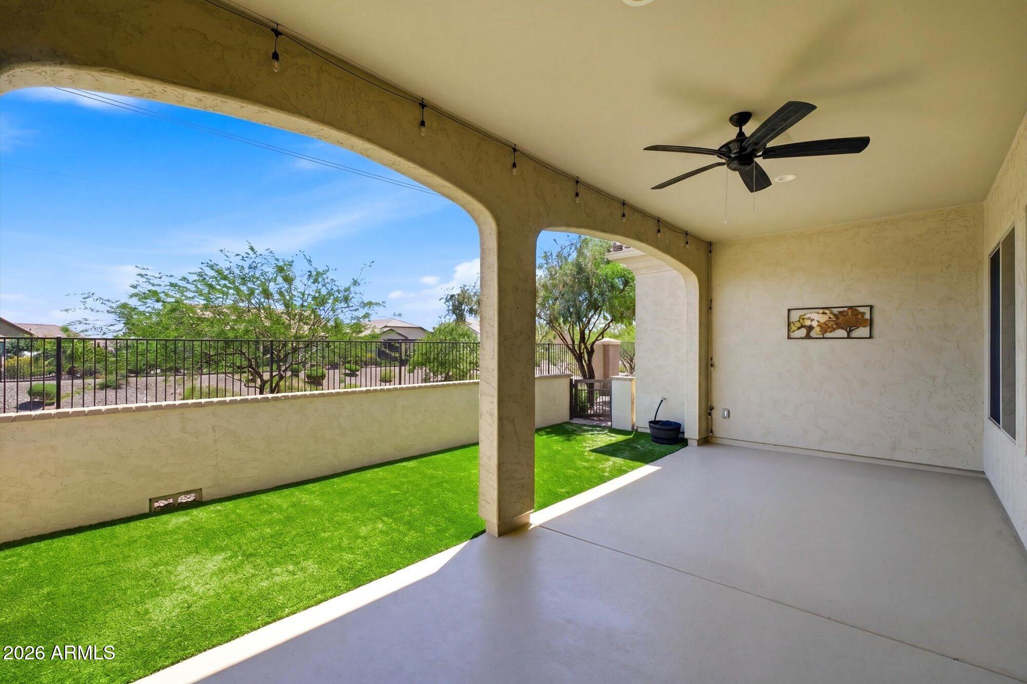 16849 West Merrell Street Goodyear, AZ 85395 - Photo 30 of 35 a view of a porch with a yard