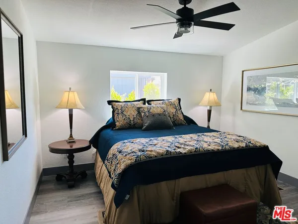 a bedroom with bed and a window