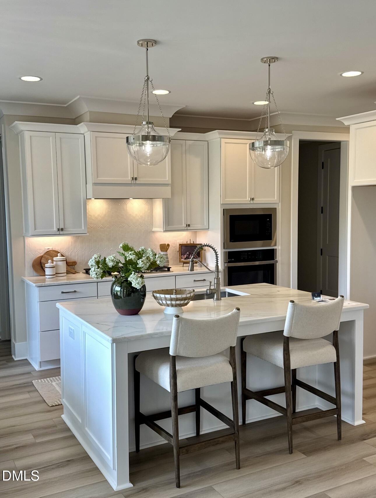 1057 Azalea Garden Circle Raleigh, NC 27603 - Photo 10 of 20 a kitchen with a table and chairs in it
