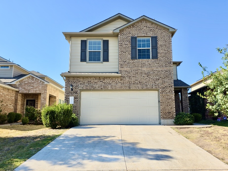 3805 Tranquil Lane Austin, TX 78728 - Photo 1 of 30 a front view of a house with a yard and garage