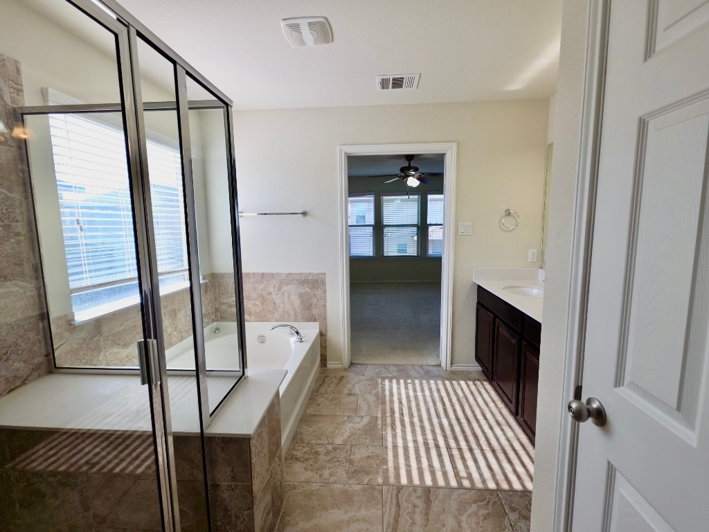 3805 Tranquil Lane Austin, TX 78728 - Photo 17 of 30 a view of a hallway with wooden floor and staircase