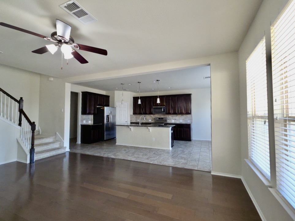3805 Tranquil Lane Austin, TX 78728 - Photo 6 of 30 a view of a kitchen with microwave and stove