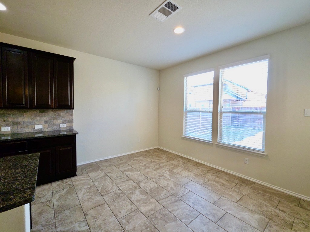 3805 Tranquil Lane Austin, TX 78728 - Photo 8 of 30 a view of an empty room with a kitchen