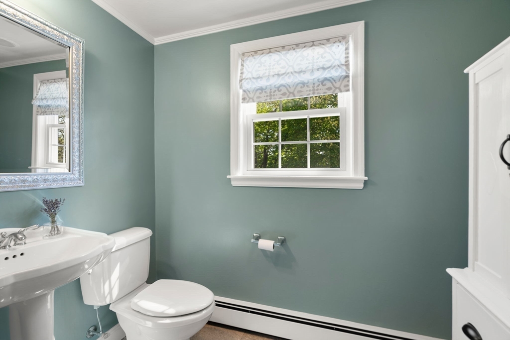 22 Crest Road Framingham, MA 01702 - Photo 19 of 38 a bathroom with a toilet a sink and a window