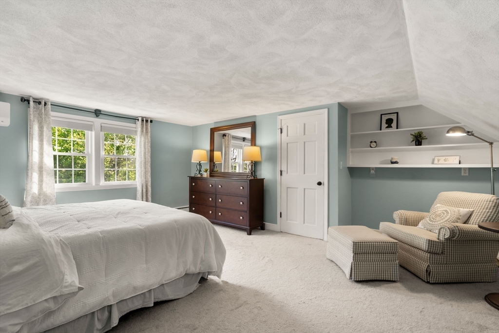 22 Crest Road Framingham, MA 01702 - Photo 22 of 38 a bedroom with a bed and a couch