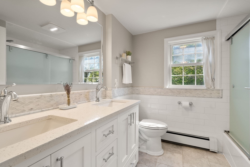 22 Crest Road Framingham, MA 01702 - Photo 24 of 38 a bathroom with a double vanity sink toilet and a tub