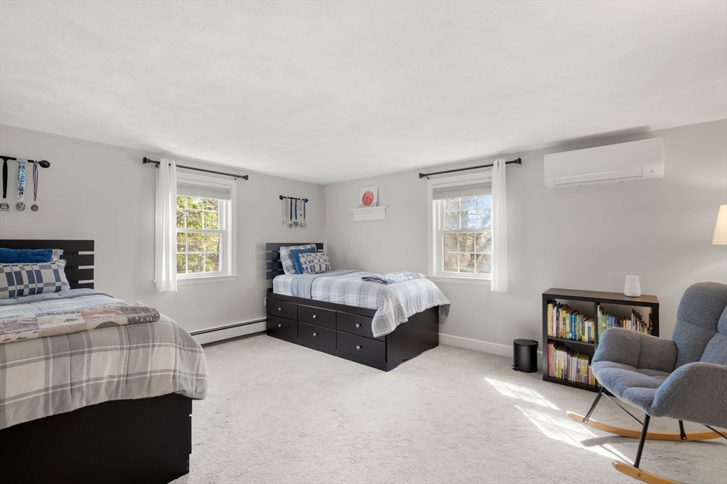 22 Crest Road Framingham, MA 01702 - Photo 25 of 38 a bedroom with a bed chair and window