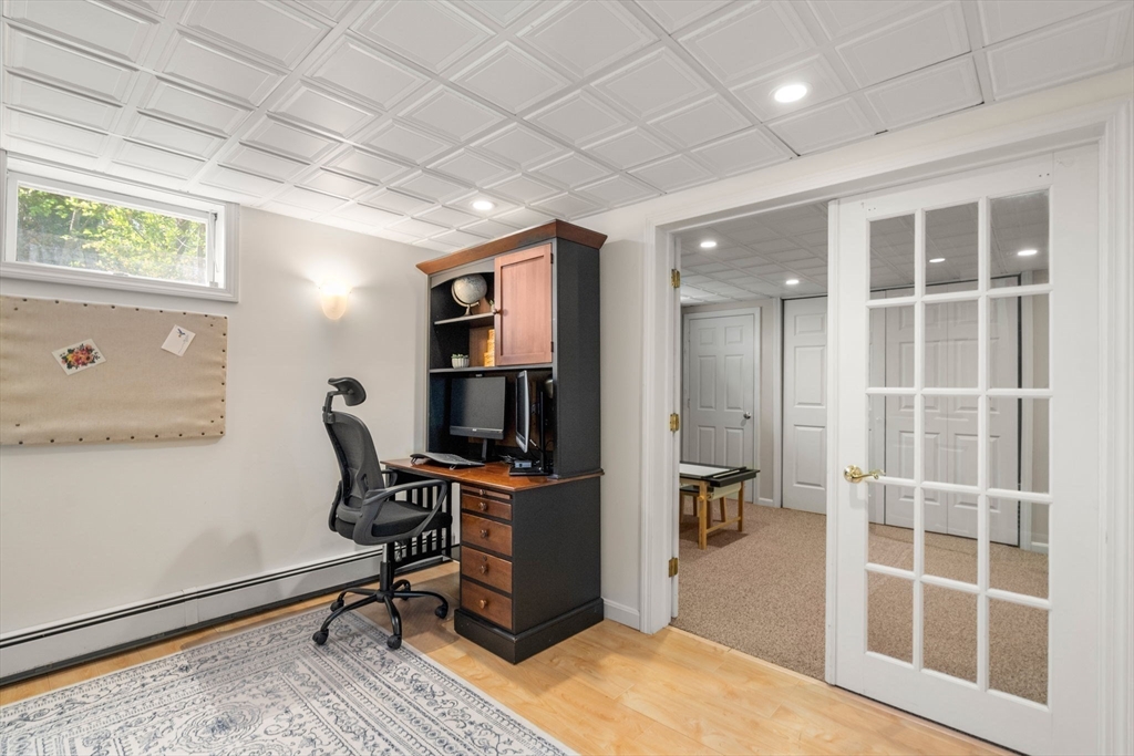 22 Crest Road Framingham, MA 01702 - Photo 26 of 38 a view of a workspace with furniture and a window