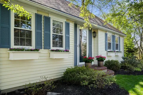 a front view of a house with a yard