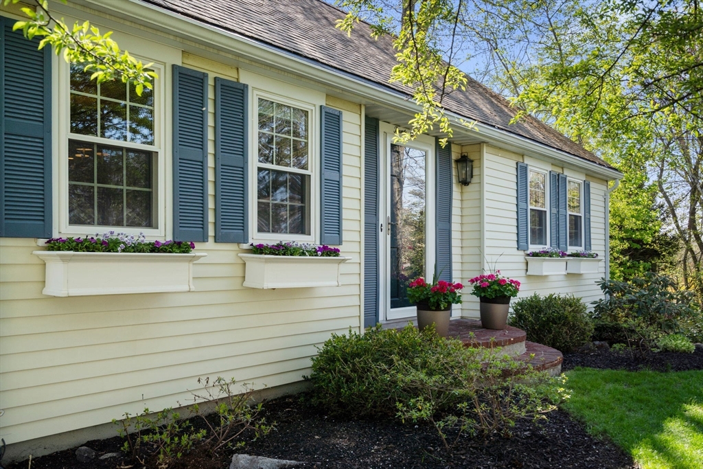22 Crest Road Framingham, MA 01702 - Photo 3 of 38 a front view of a house with a yard