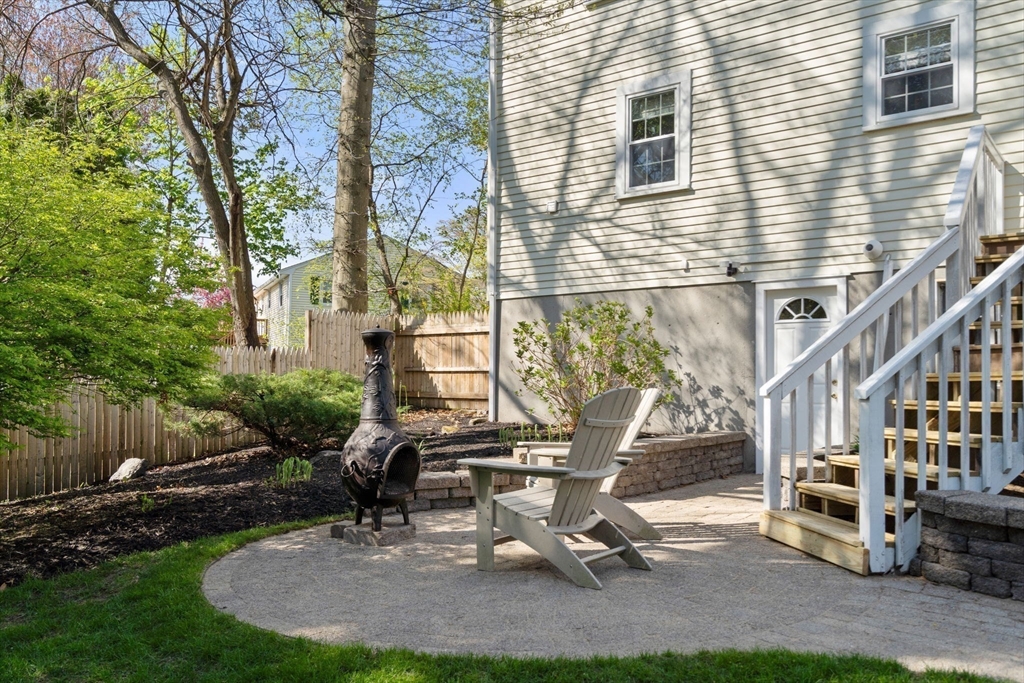 22 Crest Road Framingham, MA 01702 - Photo 33 of 38 a view of a house with backyard and sitting area
