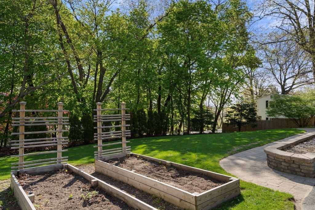 22 Crest Road Framingham, MA 01702 - Photo 36 of 38 a view of a backyard with a garden