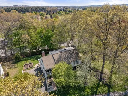 an aerial view of a house with yard and outdoor space
