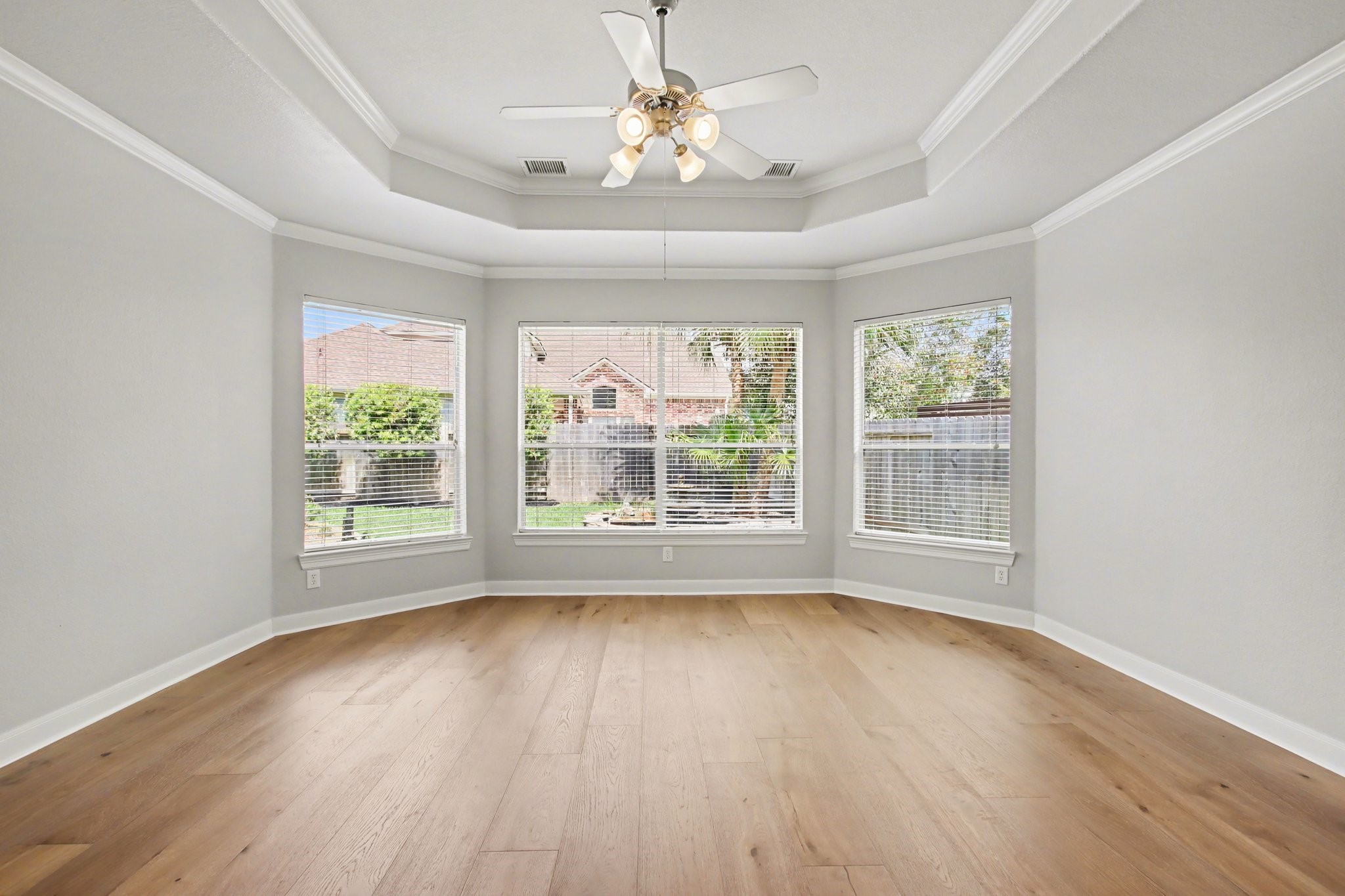 5115 Luke Ridge Lane Katy, TX 77494 - Photo 15 of 36 a view of an empty room with wooden floor and a window