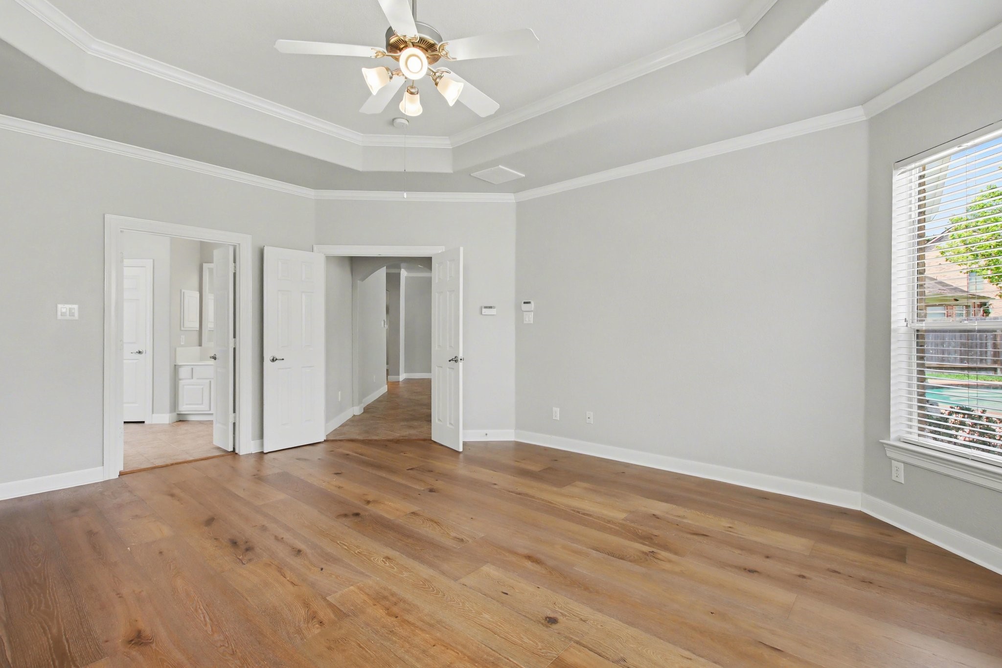 5115 Luke Ridge Lane Katy, TX 77494 - Photo 16 of 36 a view of an empty room with wooden floor and a window