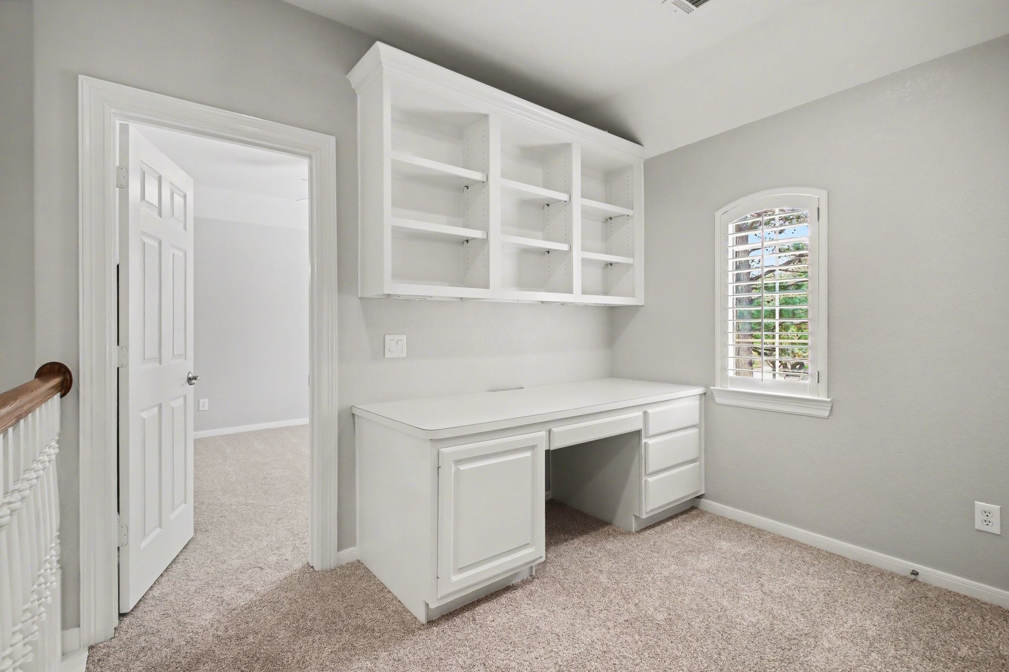 5115 Luke Ridge Lane Katy, TX 77494 - Photo 20 of 36 a kitchen with white cabinets and window