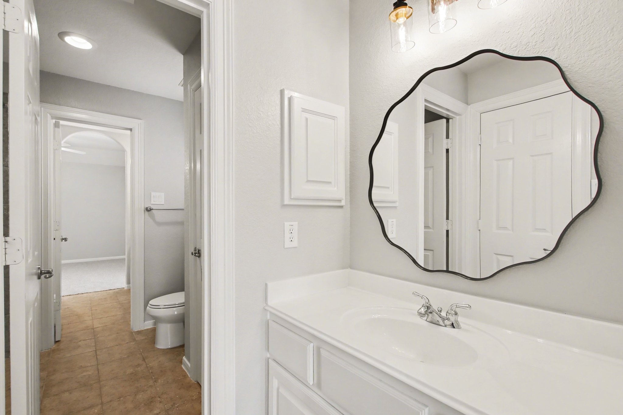 5115 Luke Ridge Lane Katy, TX 77494 - Photo 21 of 36 a bathroom with a sink a toilet and a mirror