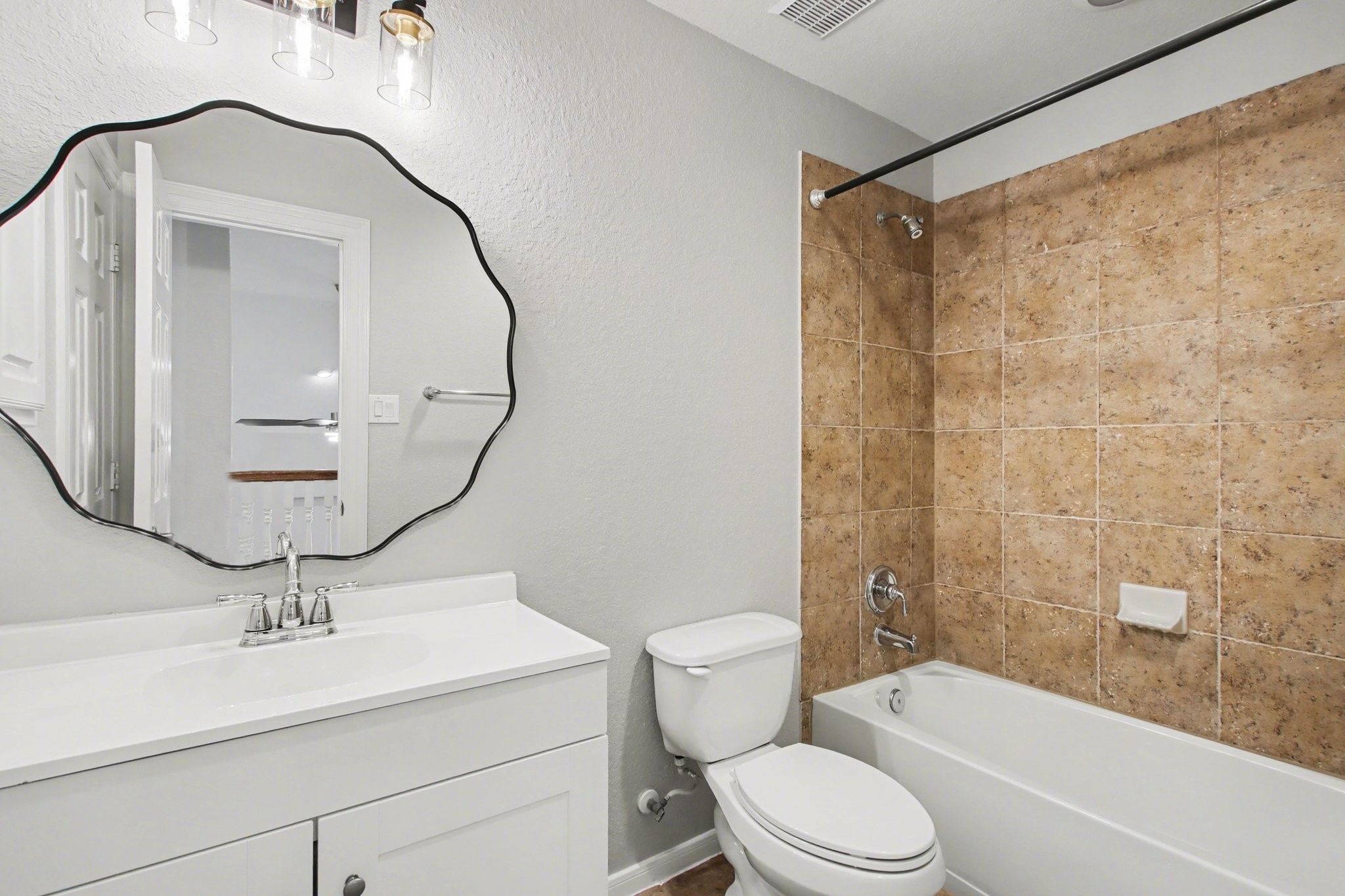 5115 Luke Ridge Lane Katy, TX 77494 - Photo 25 of 36 a bathroom with a sink a toilet and a mirror