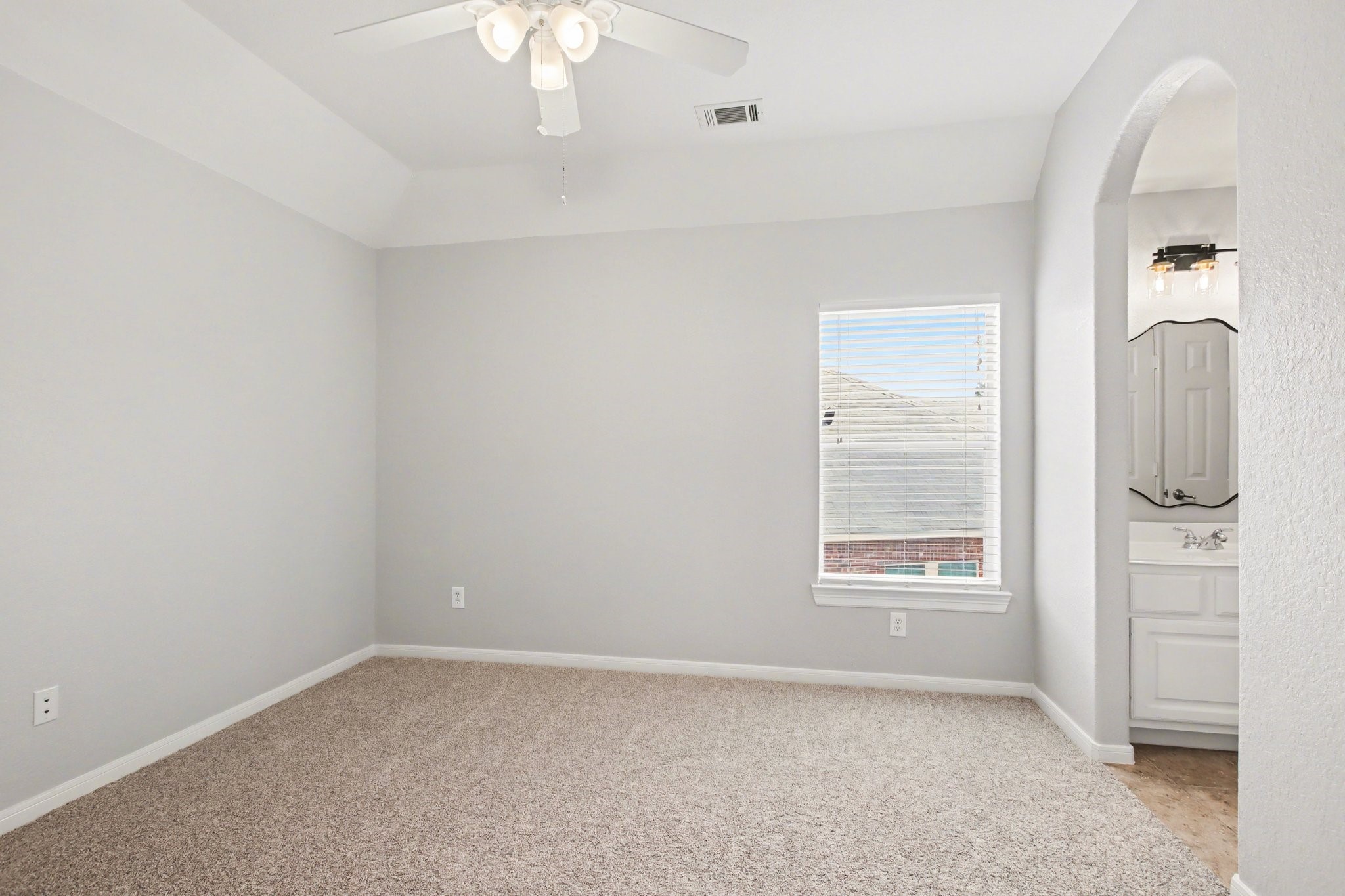 5115 Luke Ridge Lane Katy, TX 77494 - Photo 30 of 36 an empty room with windows and cabinet