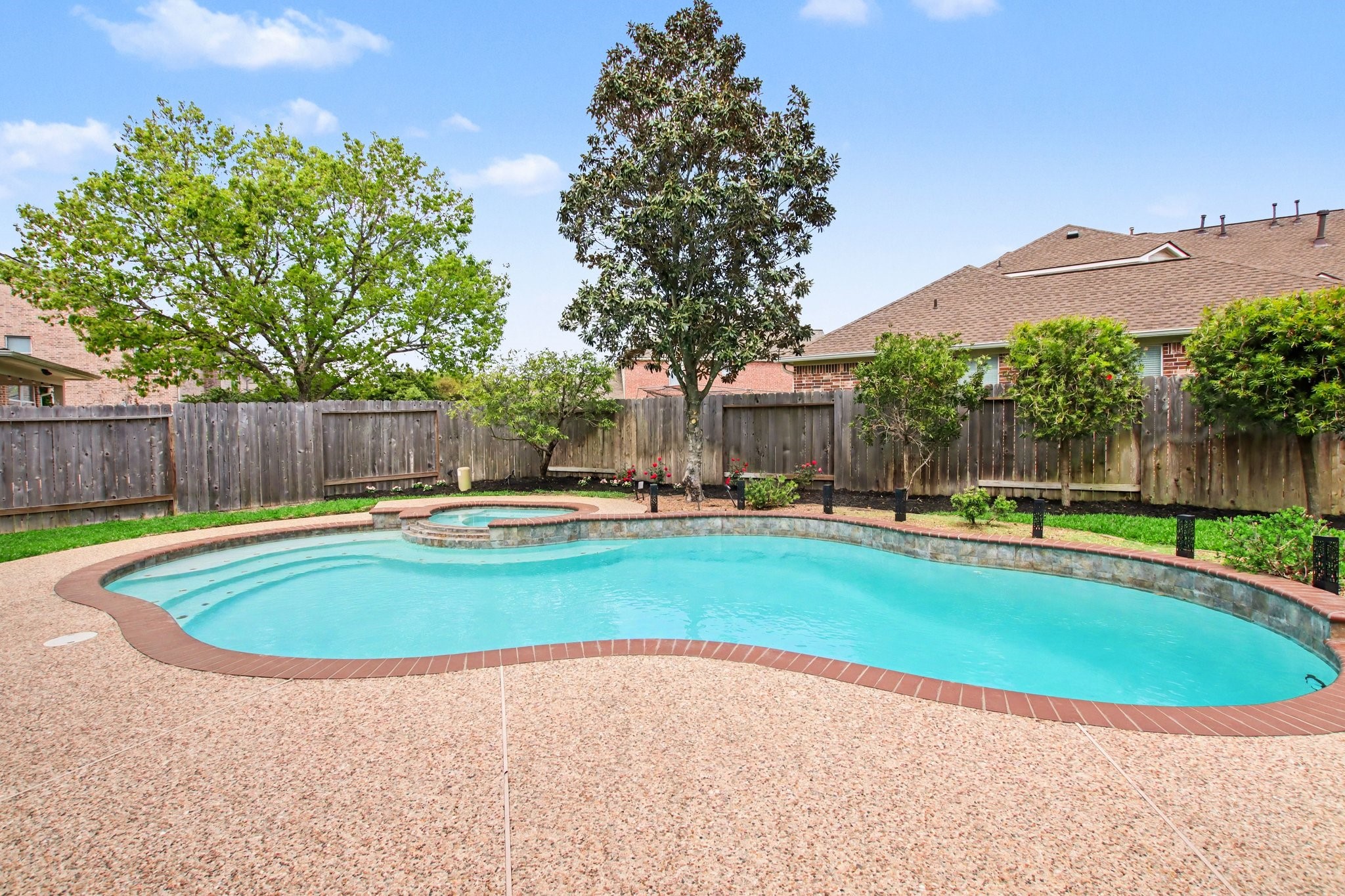 5115 Luke Ridge Lane Katy, TX 77494 - Photo 32 of 36 a view of pool with a yard and a fountain