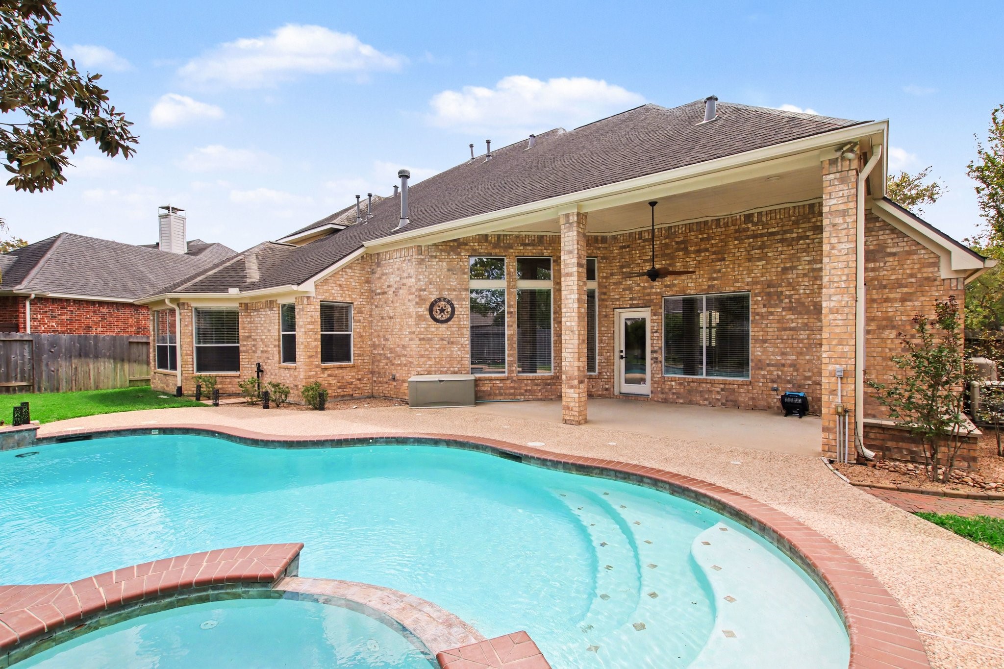 5115 Luke Ridge Lane Katy, TX 77494 - Photo 33 of 36 a view of a house with swimming pool and porch
