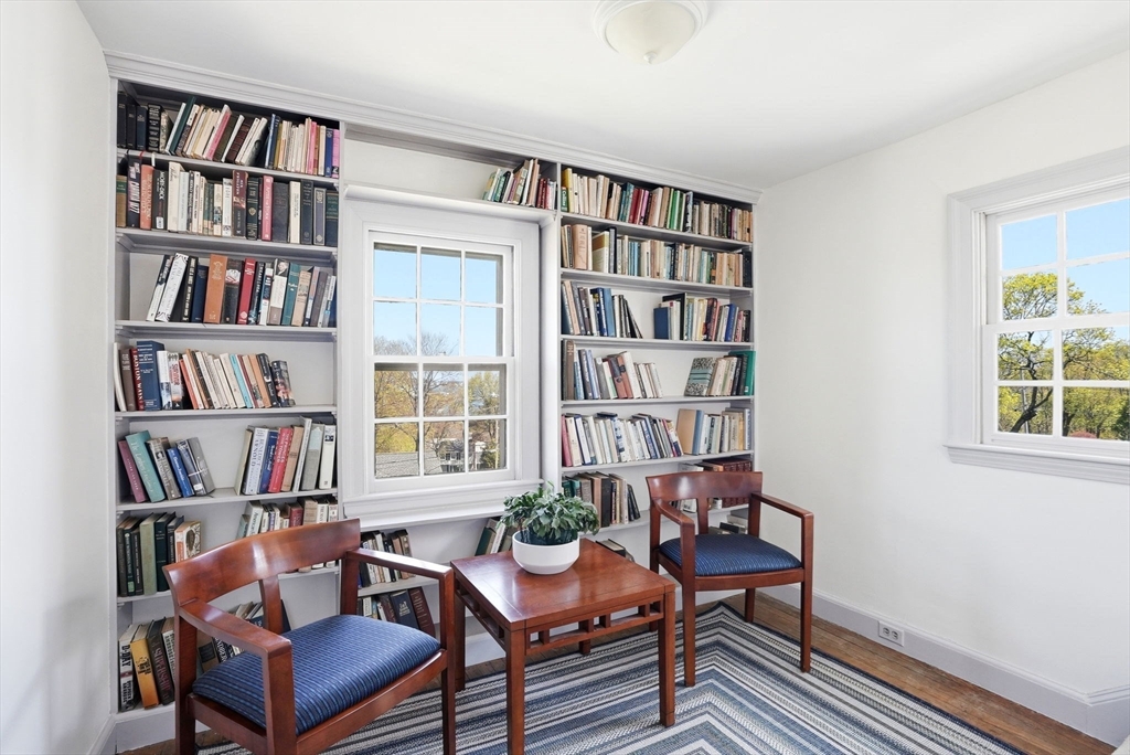 34 Governor Long Road Hingham, MA 02043 - Photo 24 of 37 a living room with furniture and a book shelf
