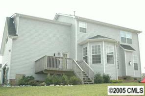 12502 Ridge Stone Court Pineville, NC 28134 - Photo 2 of 8 a front view of a house with garden