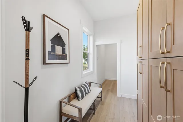 a bedroom with a bed and a mirror