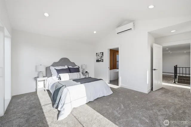 a bed room with a bed and a mirror