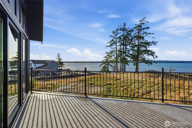 a view of a balcony with wooden floor