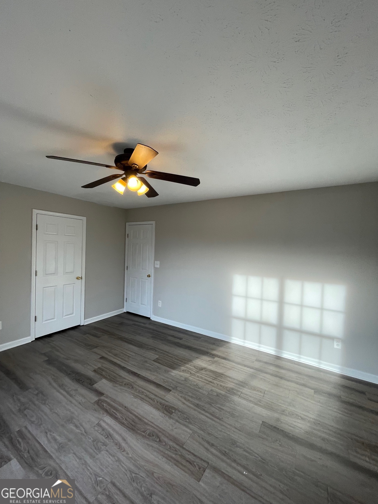42 Pope Road Villa Rica, GA 30180 - Photo 11 of 14 a view of an empty room with window and wooden floor