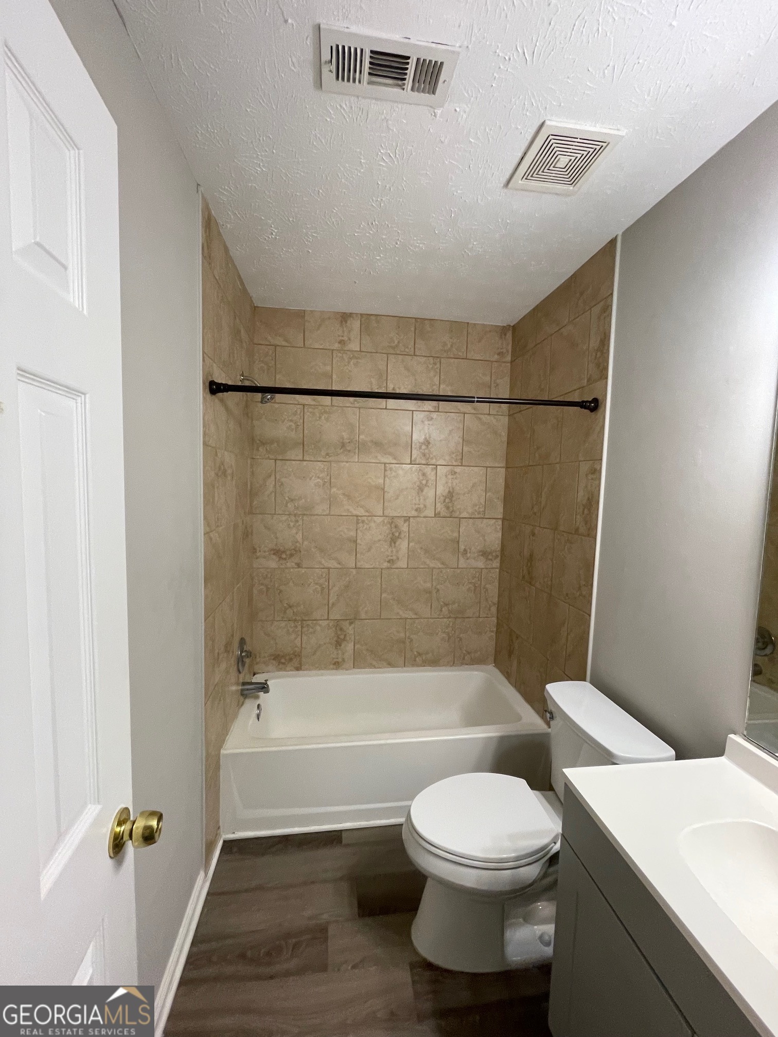 42 Pope Road Villa Rica, GA 30180 - Photo 12 of 14 a bathroom with a toilet and a bath tub