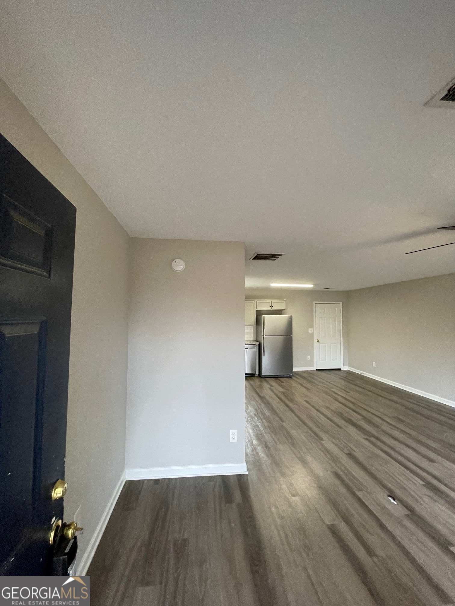42 Pope Road Villa Rica, GA 30180 - Photo 2 of 14 a view of empty room with wooden floor and fan