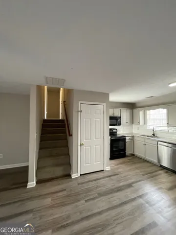 a view of a kitchen with a sink cabinets and a kitchen