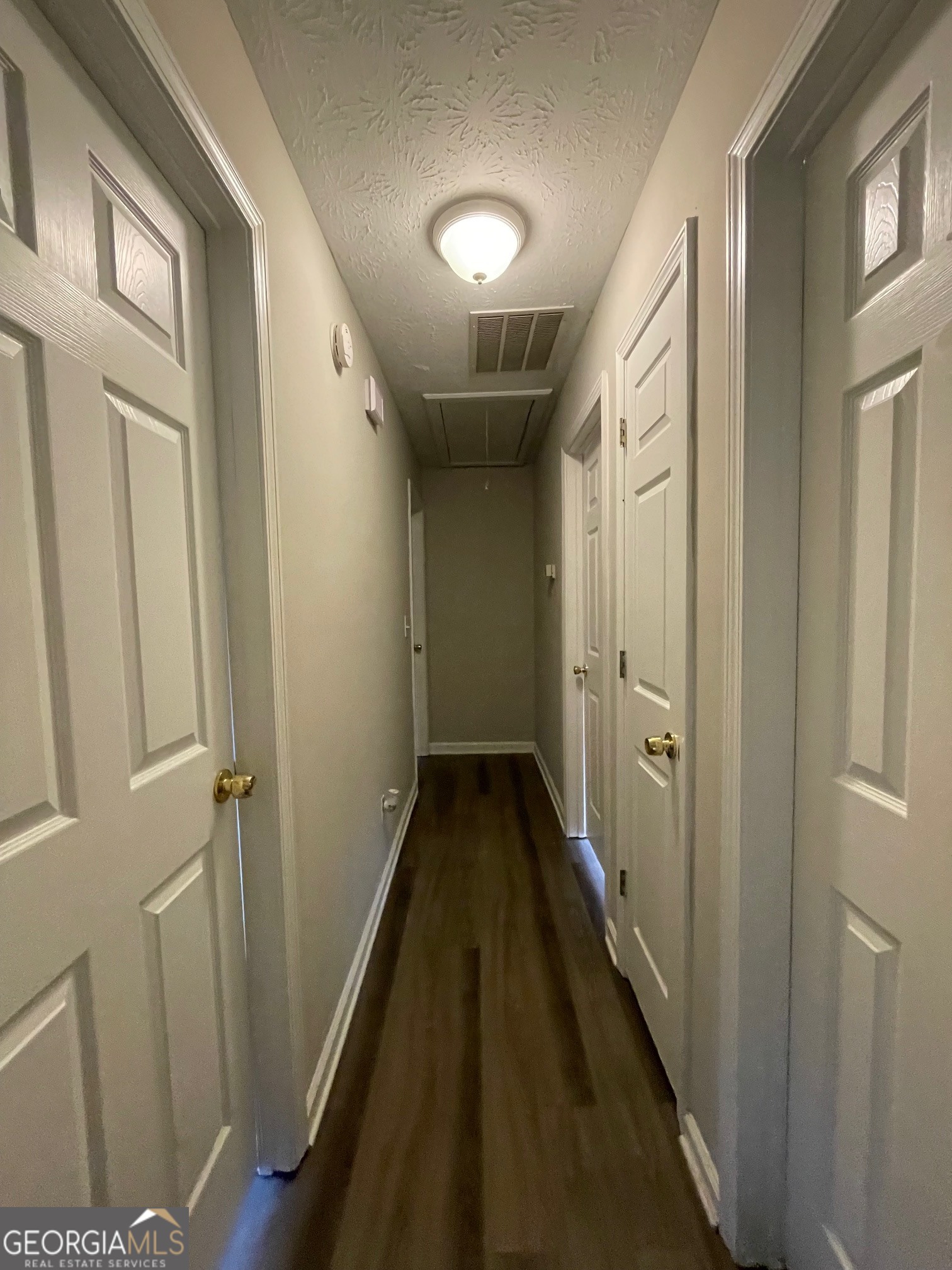 42 Pope Road Villa Rica, GA 30180 - Photo 7 of 14 a view of a hallway with wooden floor and staircase