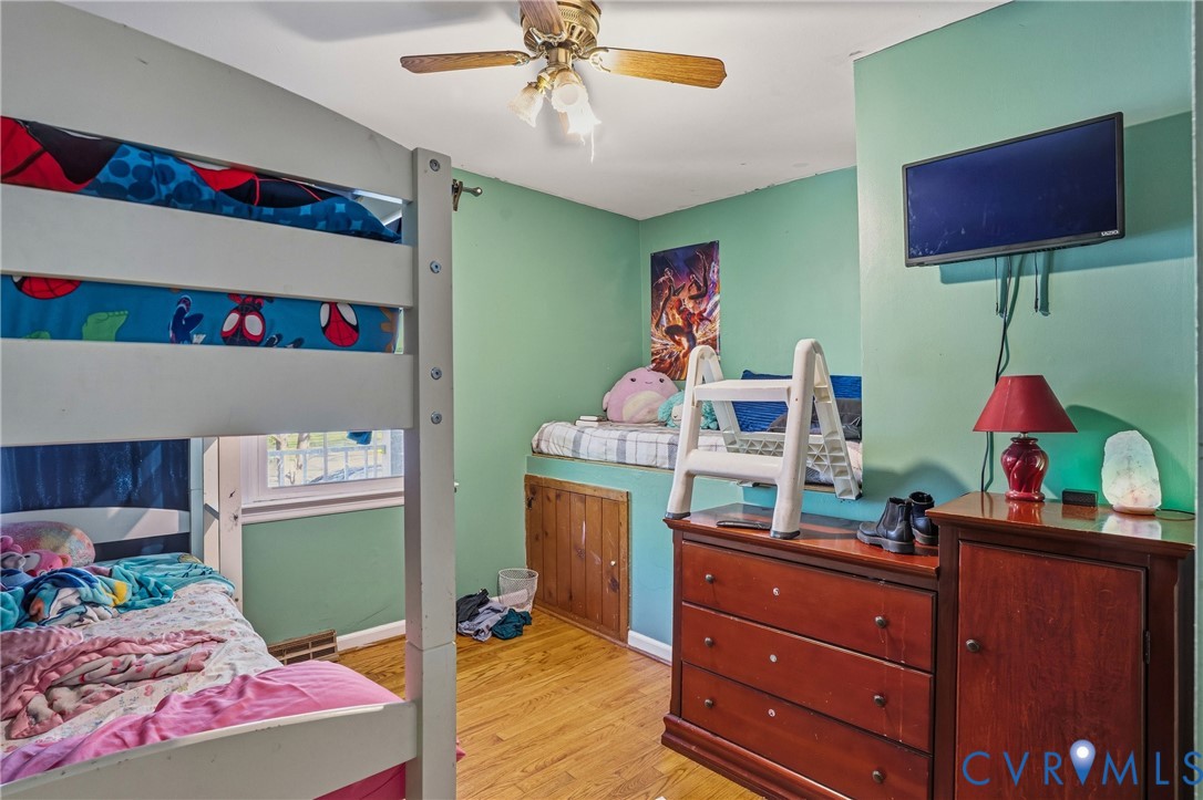 14219 Spruce Avenue Chester, VA 23836 - Photo 20 of 32 a bedroom with a bed and a dresser in it