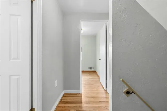 a view of a hallway with the wooden floor