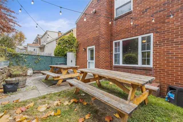 a view of a house with pool and chairs