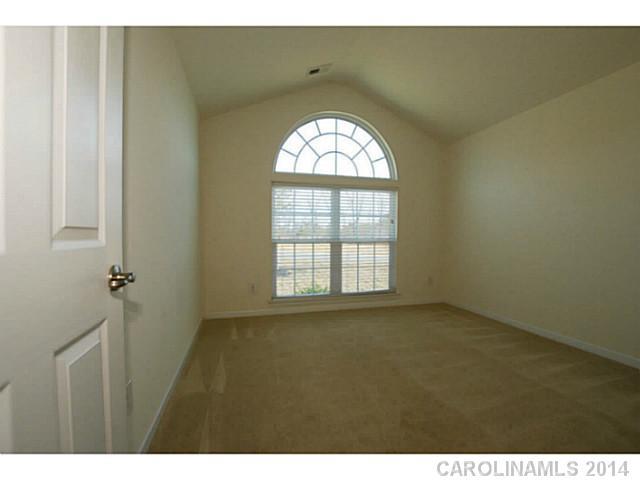 339 Calming Way Tega Cay, SC 29708 - Photo 11 of 16 a view of an empty room with a window