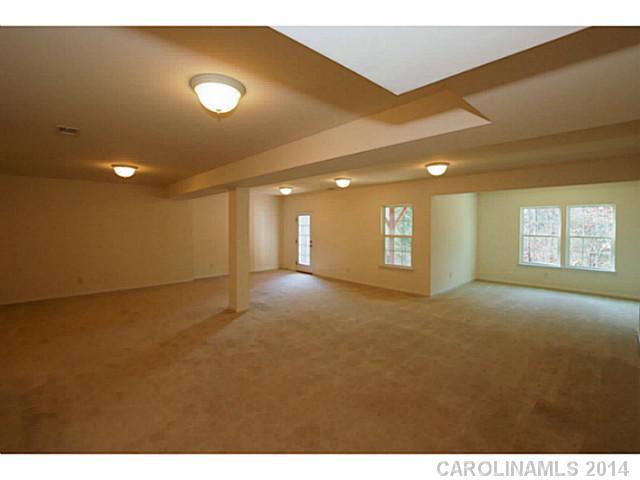 339 Calming Way Tega Cay, SC 29708 - Photo 13 of 16 a view of an empty room with a window