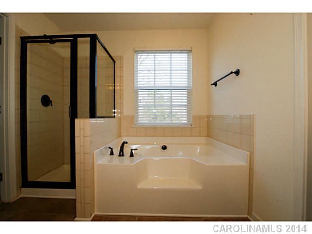 339 Calming Way Tega Cay, SC 29708 - Photo 16 of 16 a bathroom with a bathtub