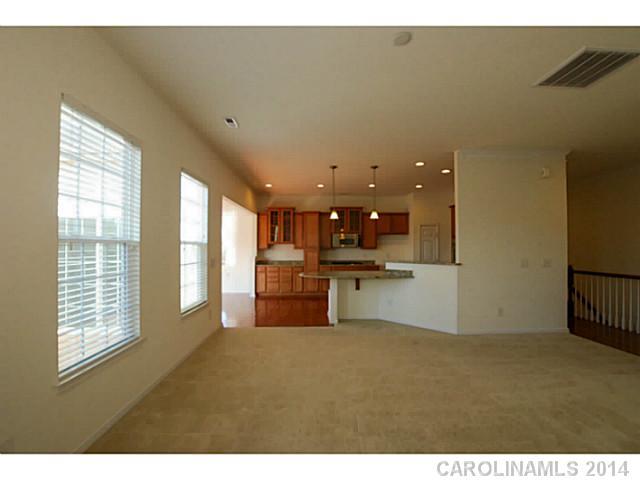 339 Calming Way Tega Cay, SC 29708 - Photo 7 of 16 a living room with furniture and a large window