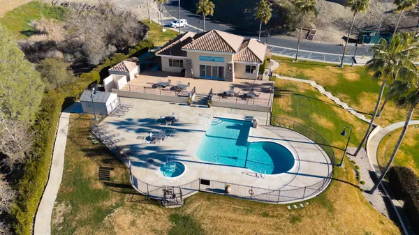 an aerial view of a house with outdoor space
