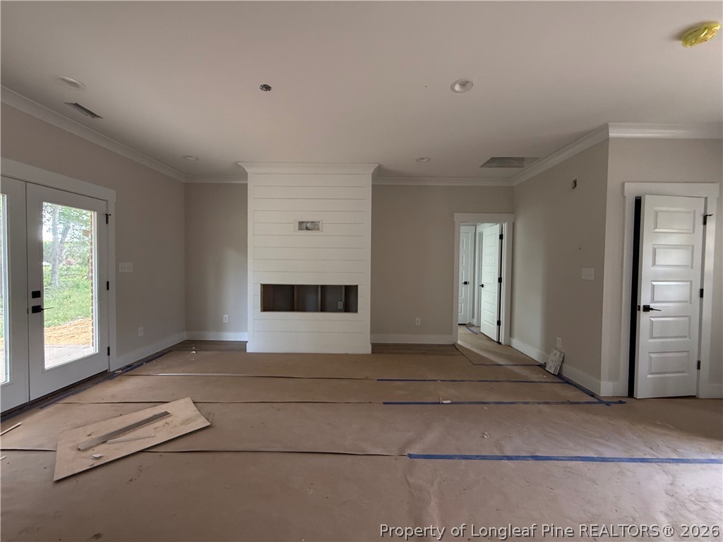 154 Ridge Stone Drive Autryville, NC 28318 - Photo 4 of 17 a view of an empty room with glass door