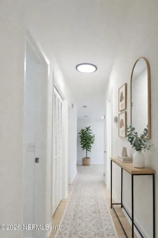 a view of an entryway with a flower pot